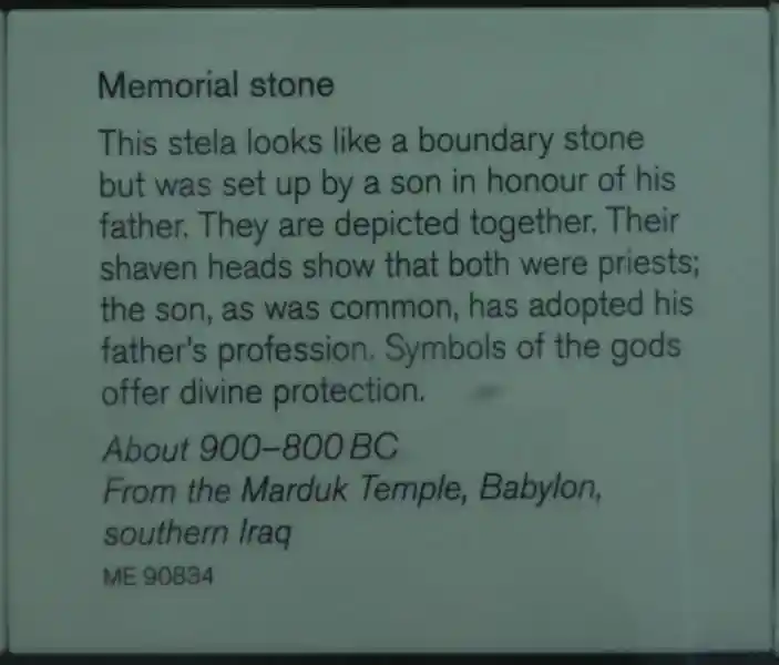 Winged disc and a crescent on a stone